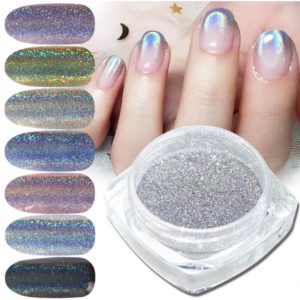 Chrome naglar pulver med färgrik chrome pigment. Chrome pulver är att göra Chrome pulver naglar, holographic pulver - Närbild på produkten och på kundens naglar